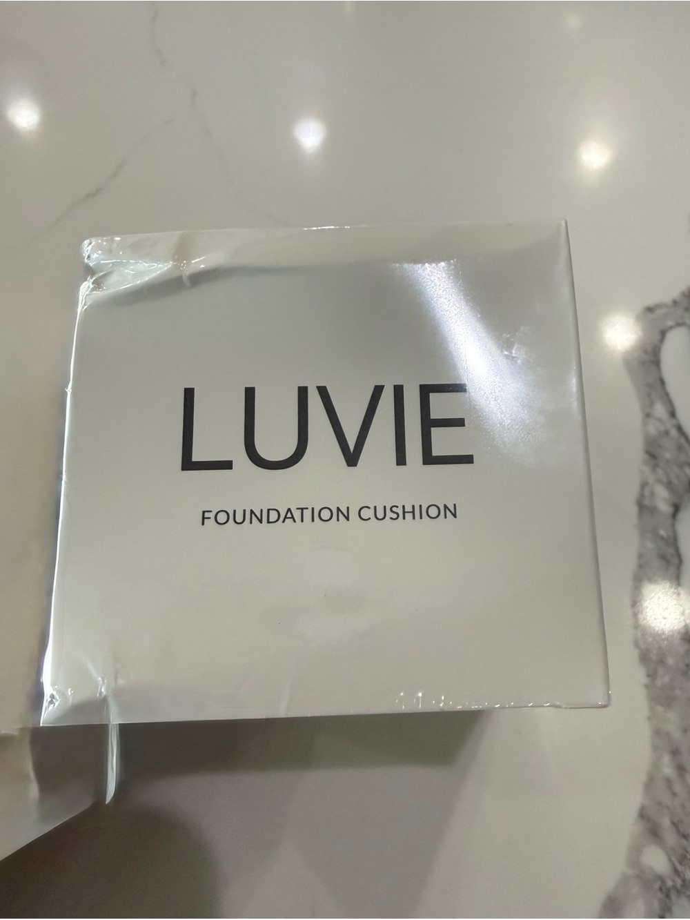 Luvie Brand Foundation with Mushroom sponge applicator.